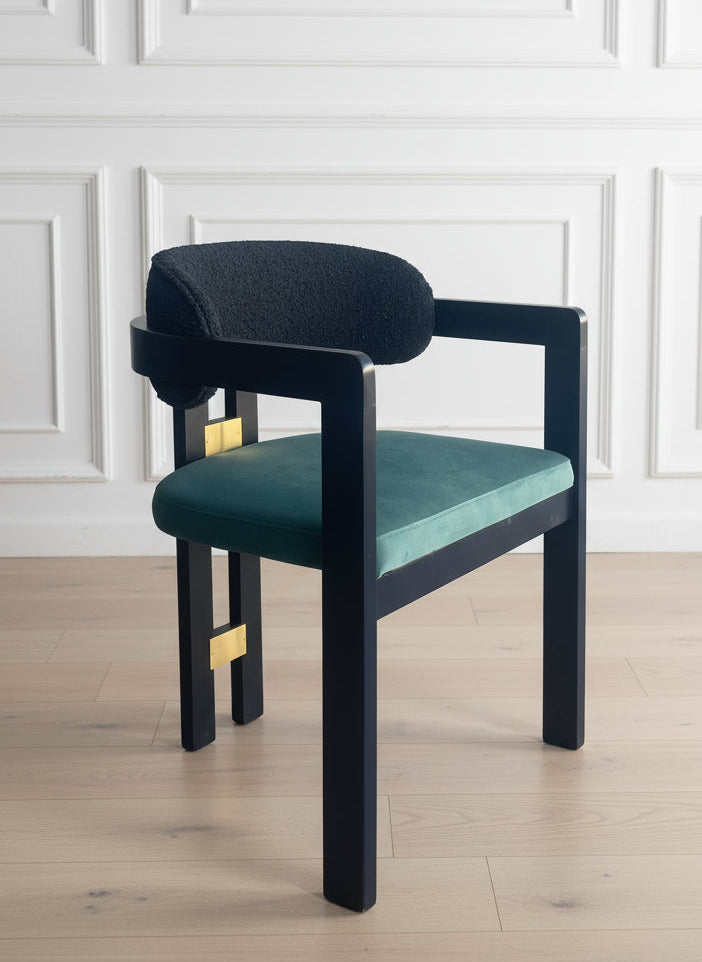 chair with black frame and teal cushion
