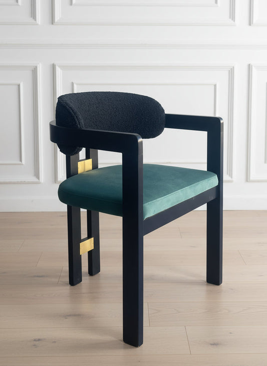 chair with black frame and teal cushion