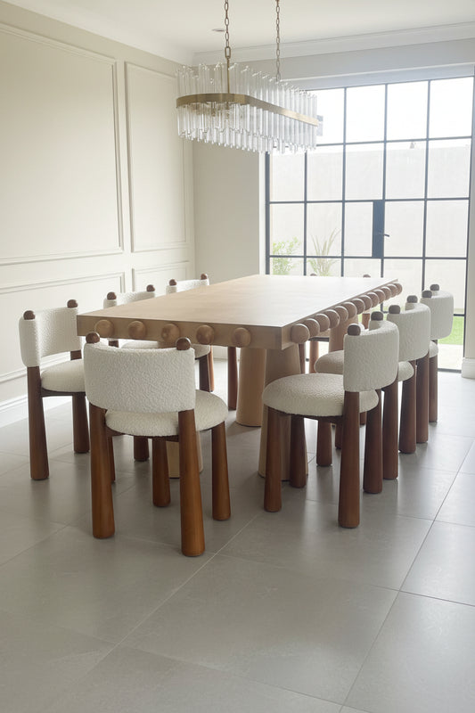 ball design dining table set with white boucle chairs with cone legs