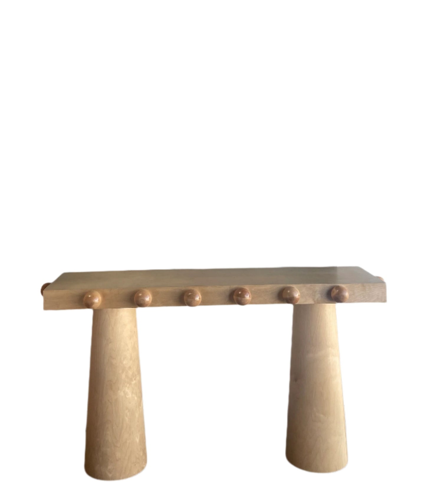 light wood console table with ball design by Statements by J
