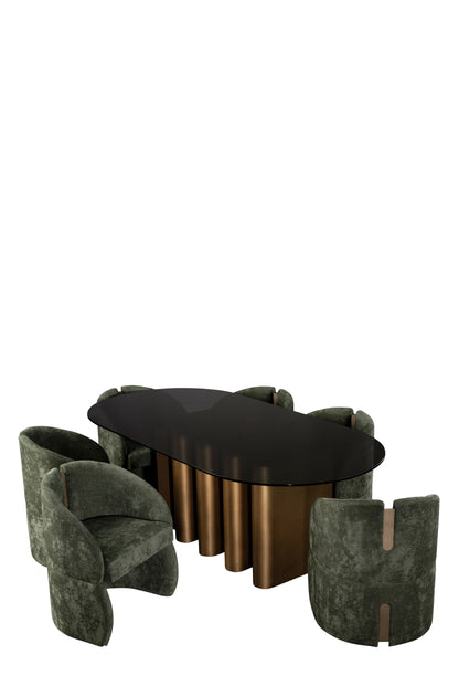 luxury dining set with a brass table and green chairs 
